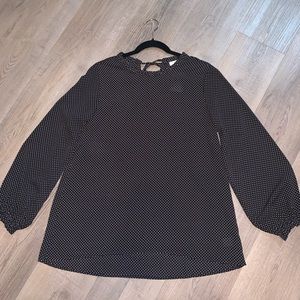 Black polka dot blouse.